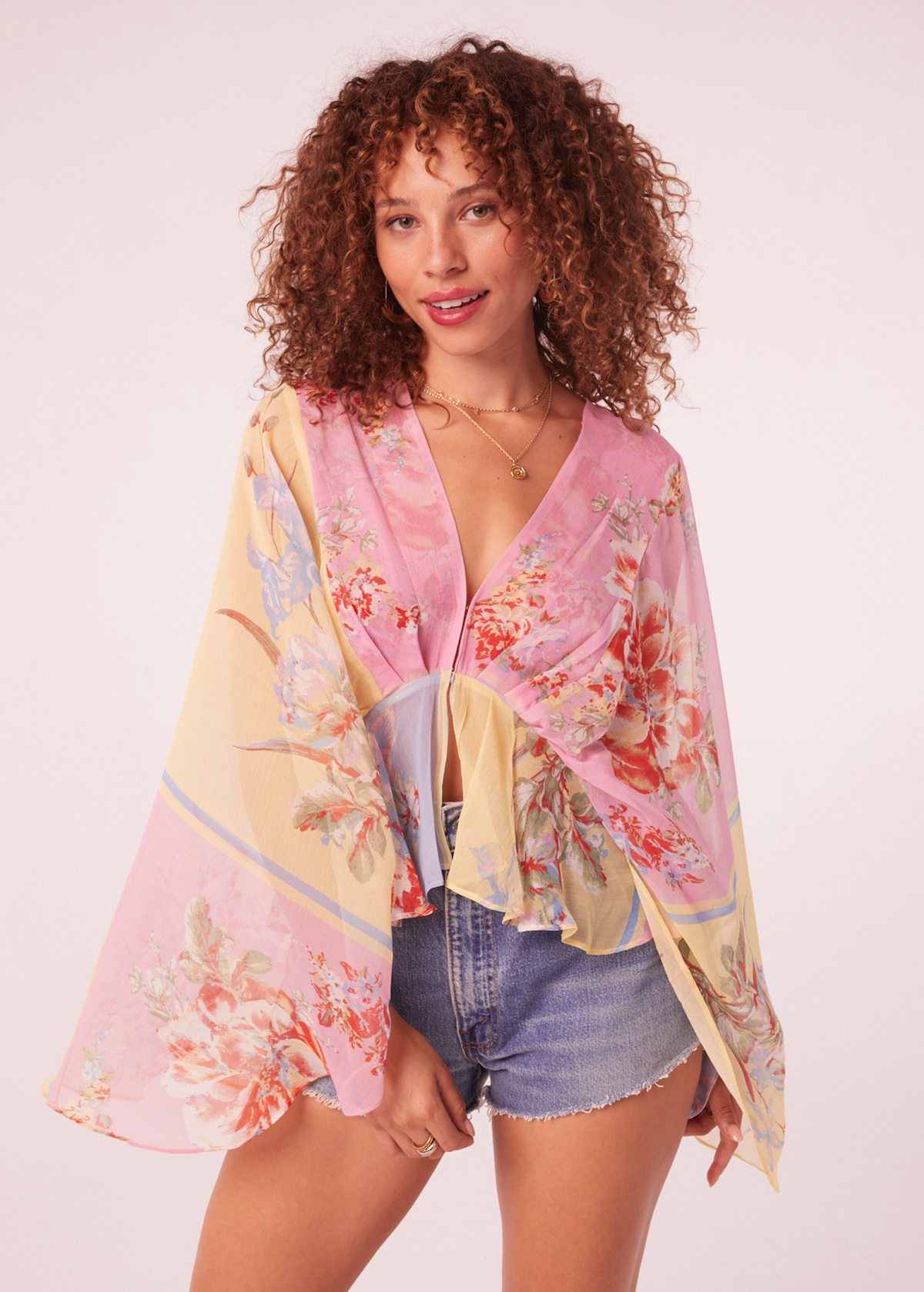 70s inspired dreamy floaty chiffon batwing cape top in yellow, pink, and blue floral by Band of the Free