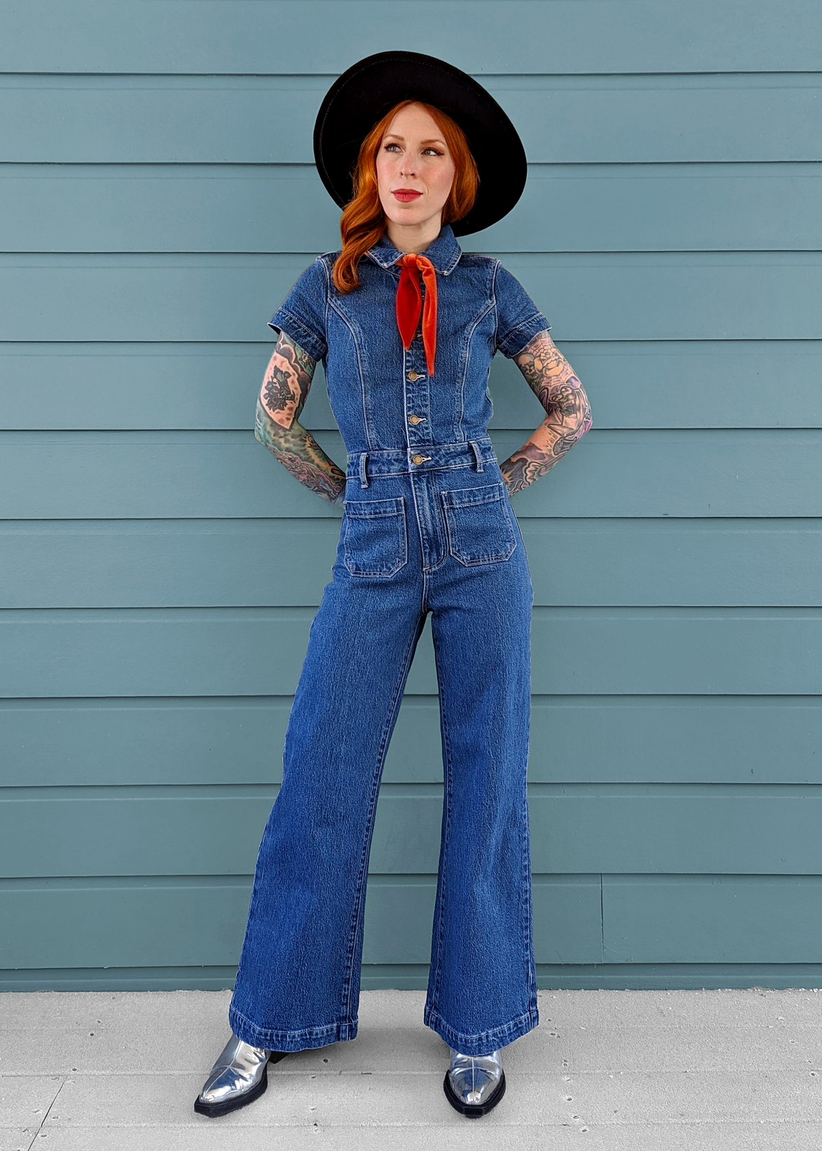 Rolla's Jeans retro 70s inspired blue denim jumpsuit featuring a collared neckline, button front, patch sailor pockets at front, and a wide sailor leg with a cropped ankle length.