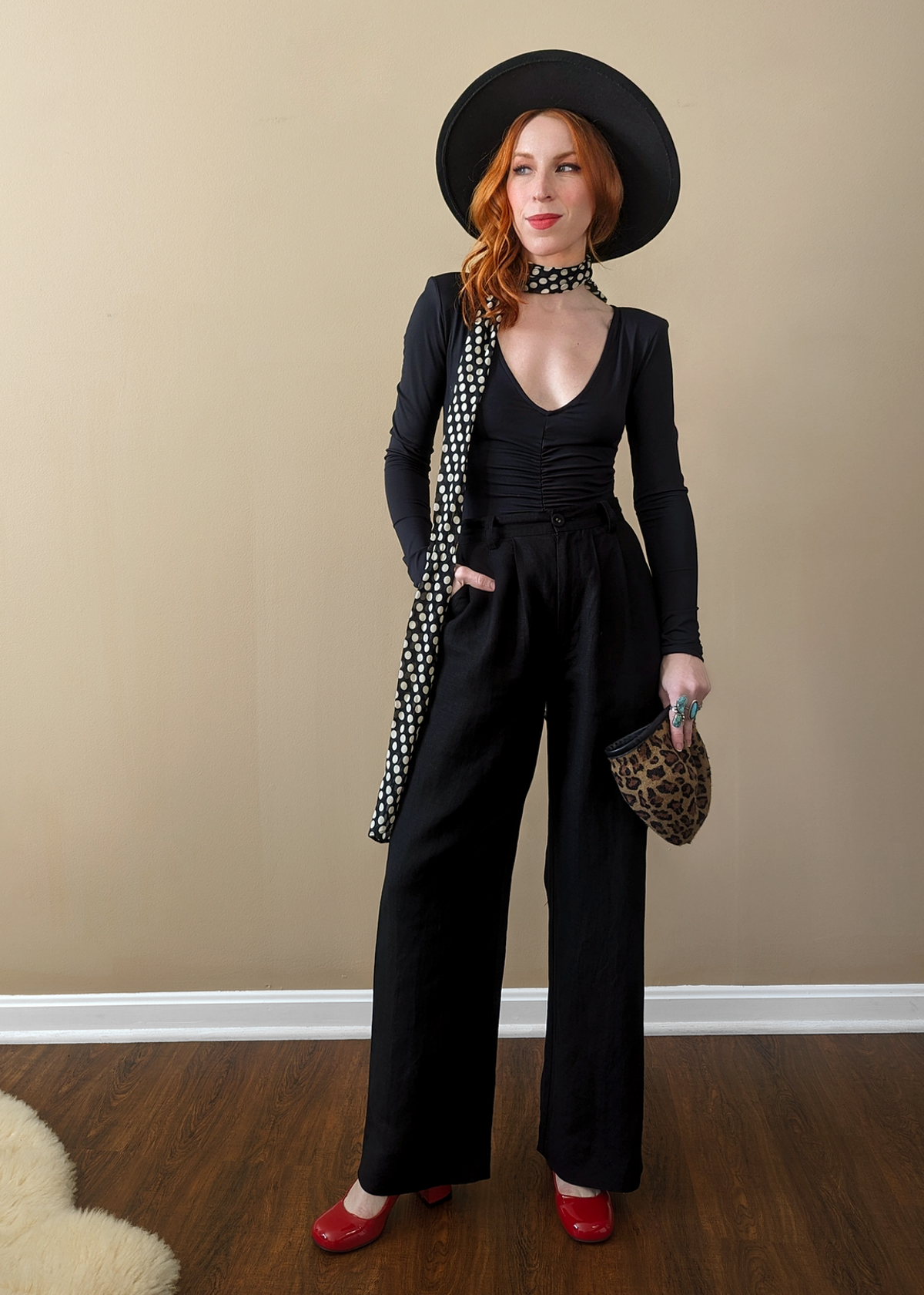 The Rolla's Jeans Chloe Pleat Linen pant: 80s menswear inspired black linen blend pants with a high rise waist, pleated front, and relaxed ankle length leg.