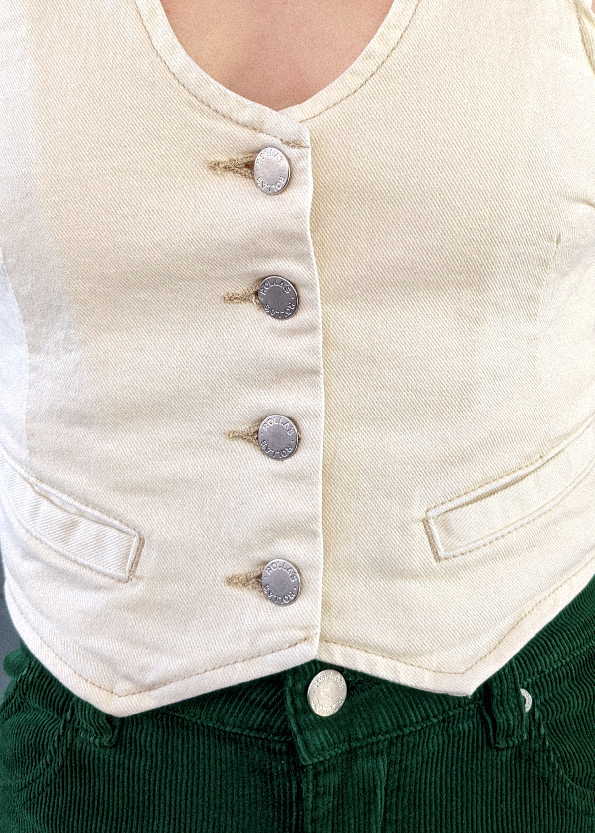 70s 80s inspired Rolla's Jeans Denim Dallas Vest in Buttercream Ivory. V-neckline, button front, and adjustable buckle at back.
