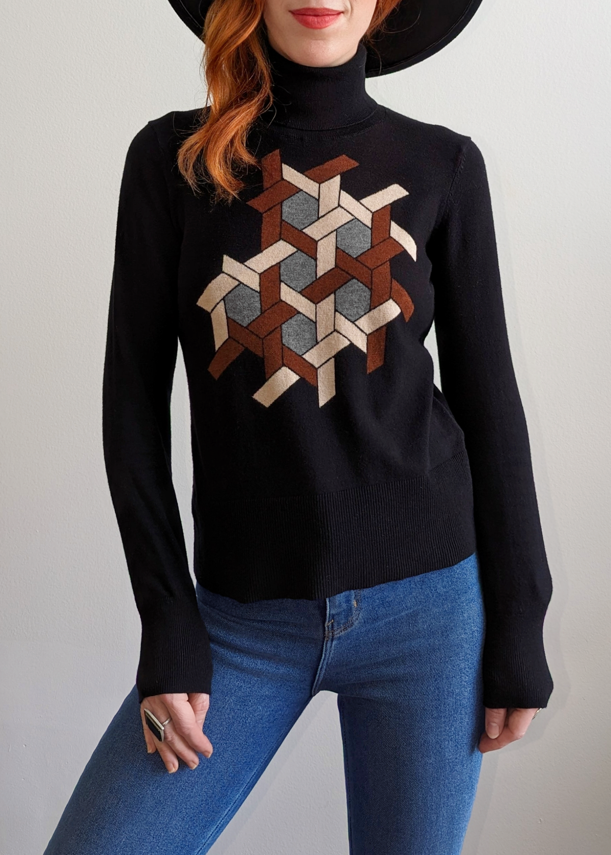 70s inspired cotton nylon wool black turtleneck knit sweater with brown, tan, and grey puzzle design at front by Nice Things by Paloma S. 