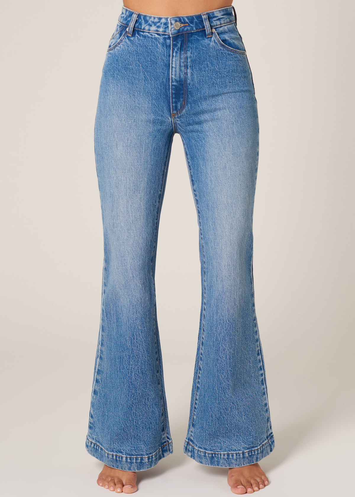 The Rolla's Jeans Salty Blue Denim Eastcoast Flares. 70s inspired bell bottom jeans with a high rise waist and faded blue denim wash.