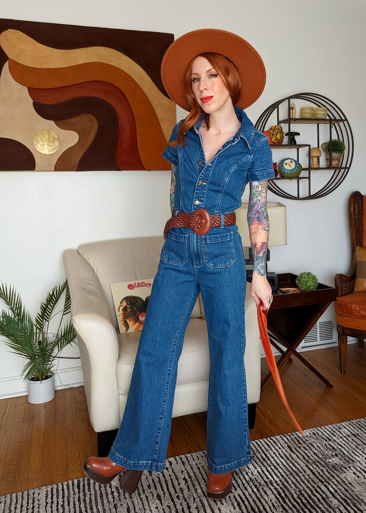 Rolla's Jeans retro 70s inspired blue denim jumpsuit featuring a collared neckline, button front, patch sailor pockets at front, and a wide sailor leg with a cropped ankle length.