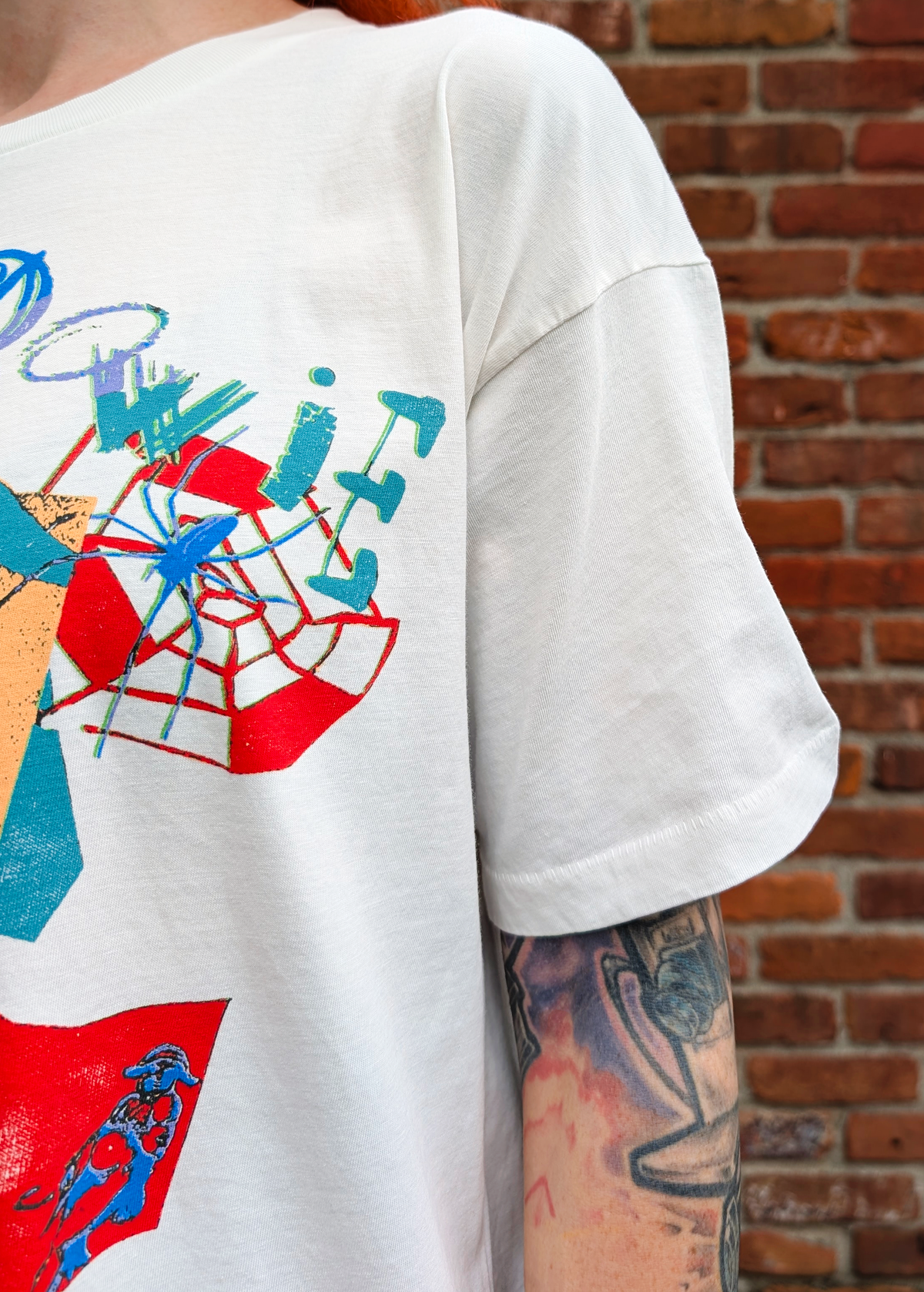 Sleeve details of a single stitch hem on the David Bowie tee