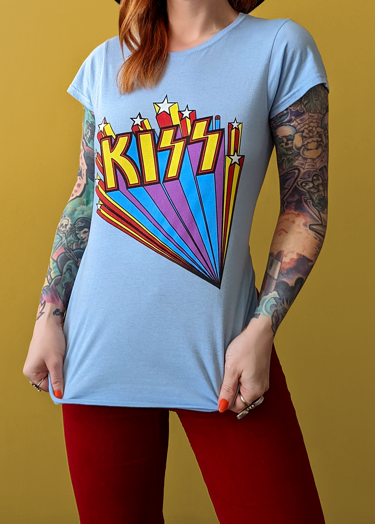 Retro Fitted sky blue KISS band tee with rainbow and stars design in yellow, purple, blue, and red. Officially licensed.