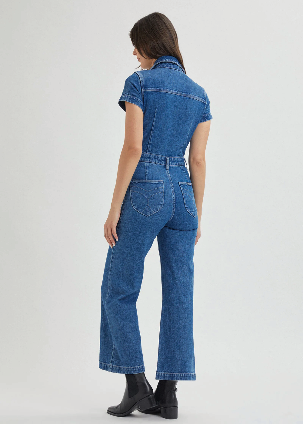 Rolla's Jeans retro 70s inspired blue denim jumpsuit featuring a collared neckline, button front, patch sailor pockets at front, and a wide sailor leg with a cropped ankle length.