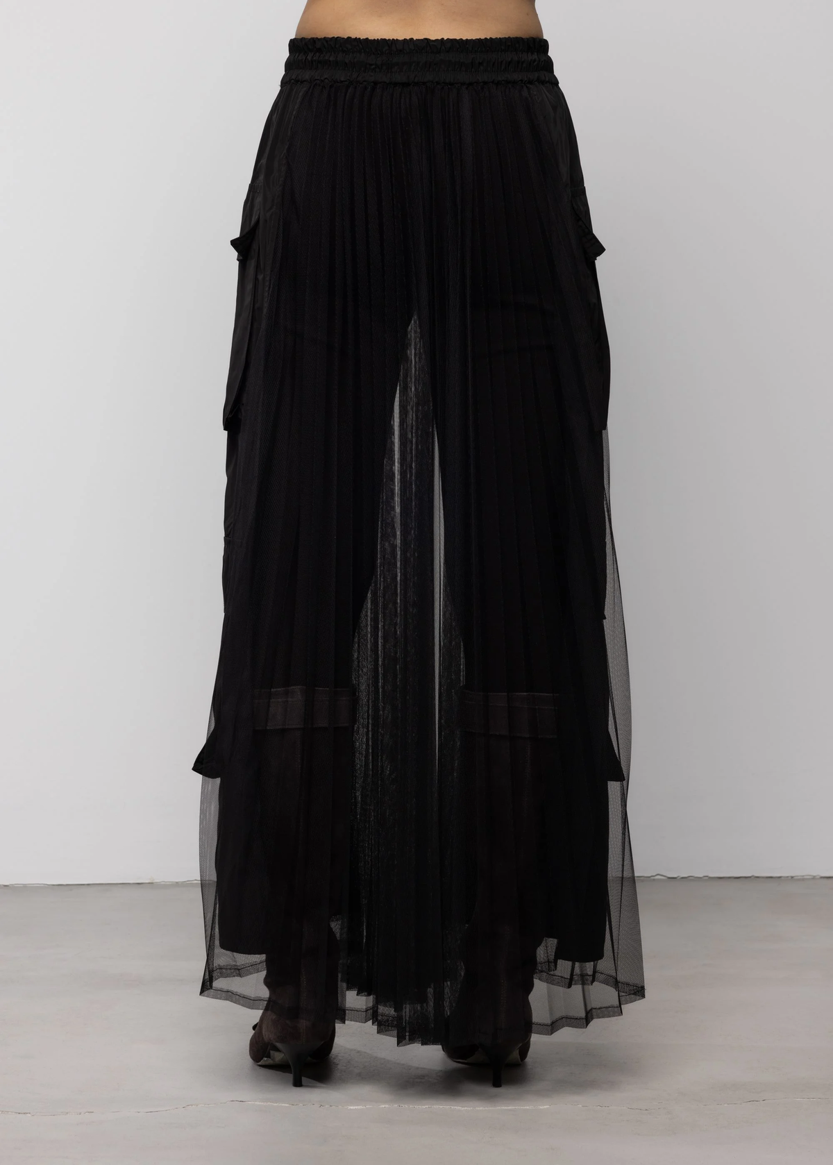 Black sheer skirt with a white background