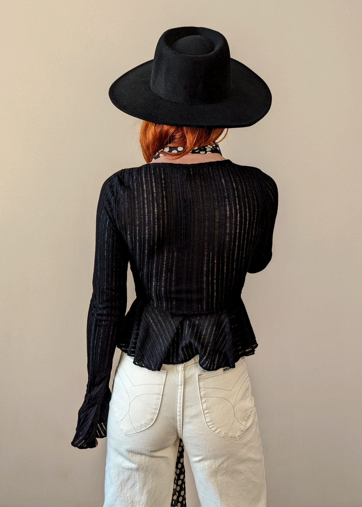 Motel Rocks Black Sheer Woven Knit Cardigan with a deep v neckline, button front, and fluted bell sleeves