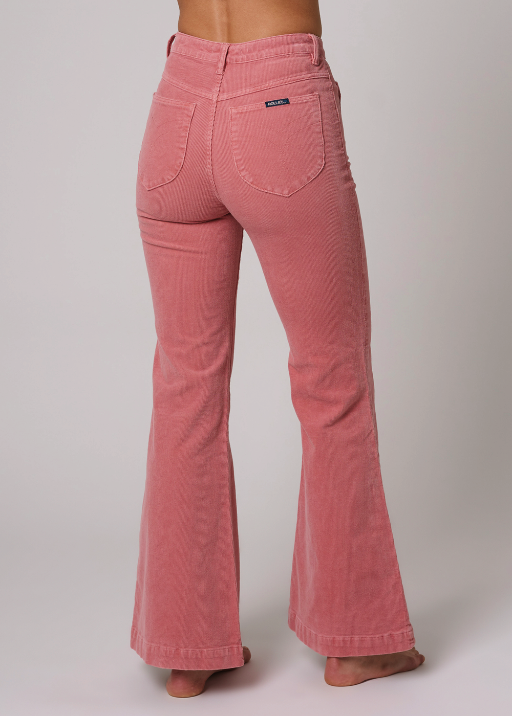 Retro 70s inspired Rolla's Eastcoast Corduroy Flare Bell Bottoms with Sailor Patch Pockets. Rose pink colorway. 