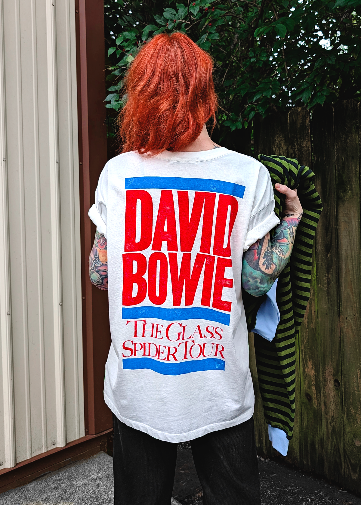 Slouchy, oversized fit white tee with colorful David Bowie The Glass Spider Tour graphics in large font at back in red and blue. Made in the USA and officially licensed