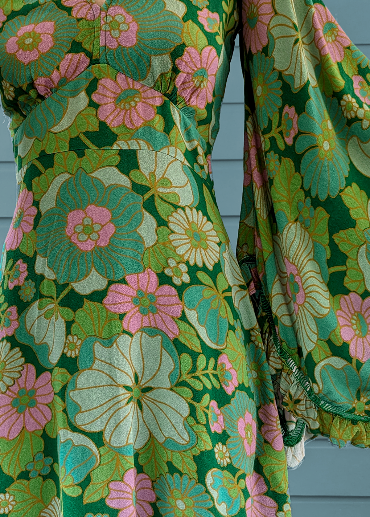 60s 70s inspired Angel Bell Sleeve Vixen Mini Dress in Arcadia green and pink floral by Nine Lives Bazaar