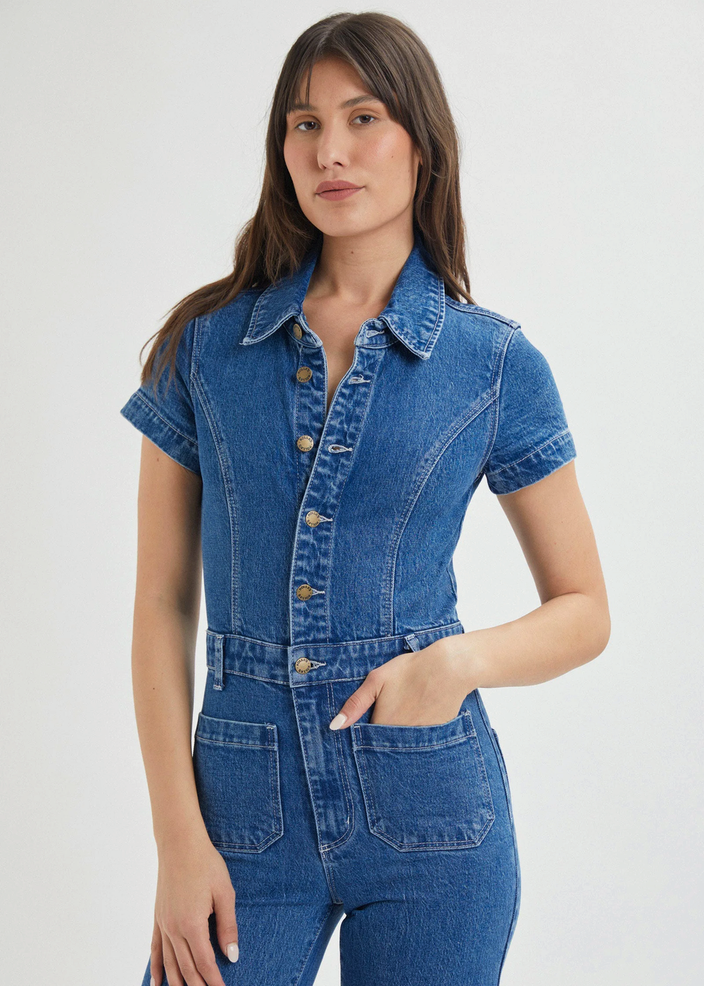 Rolla's Jeans retro 70s inspired blue denim jumpsuit featuring a collared neckline, button front, patch sailor pockets at front, and a wide sailor leg with a cropped ankle length.