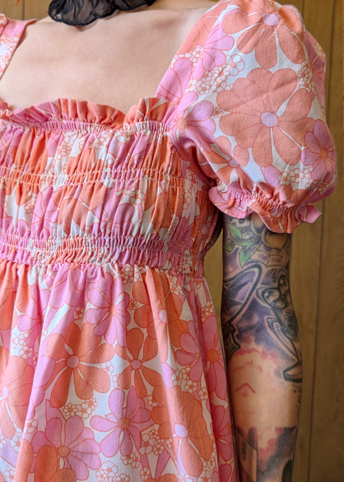 Person wearing a floral dress - close up details of fabric