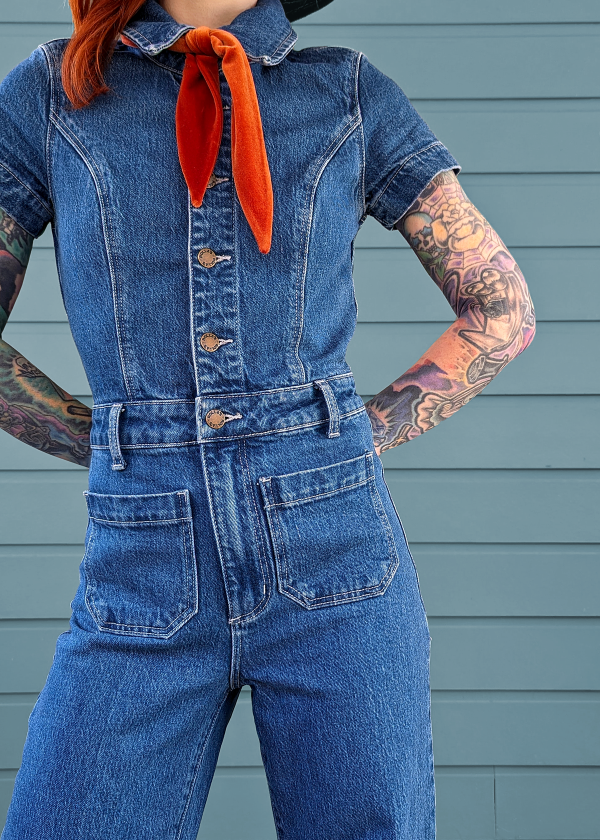 Rolla's Jeans retro 70s inspired blue denim jumpsuit featuring a collared neckline, button front, patch sailor pockets at front, and a wide sailor leg with a cropped ankle length.