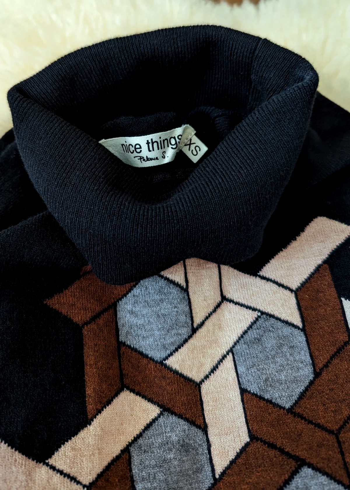 70s inspired cotton nylon wool black turtleneck knit sweater with brown, tan, and grey puzzle design at front by Nice Things by Paloma S. 