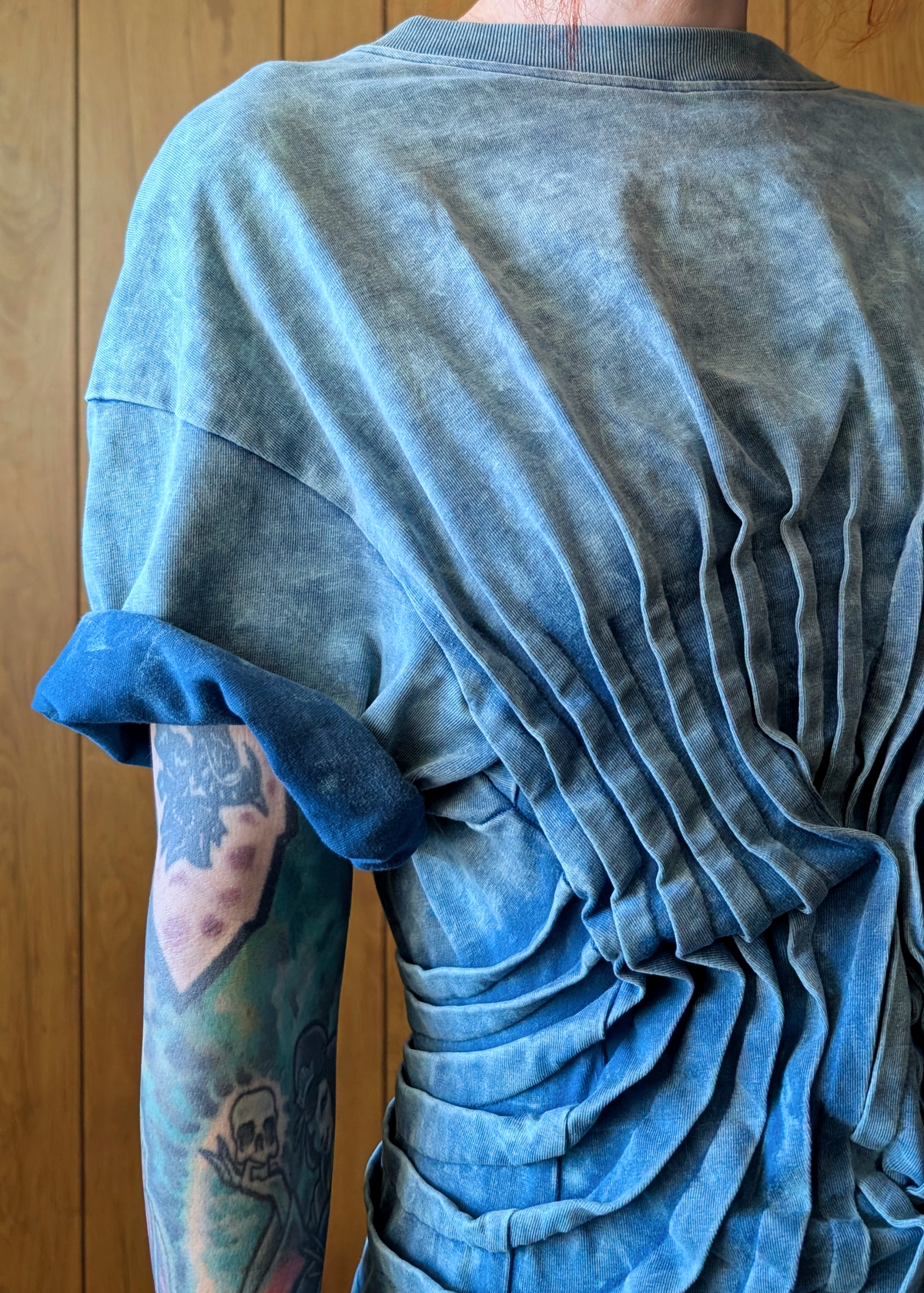 Blue t-shirt details with a wooden background