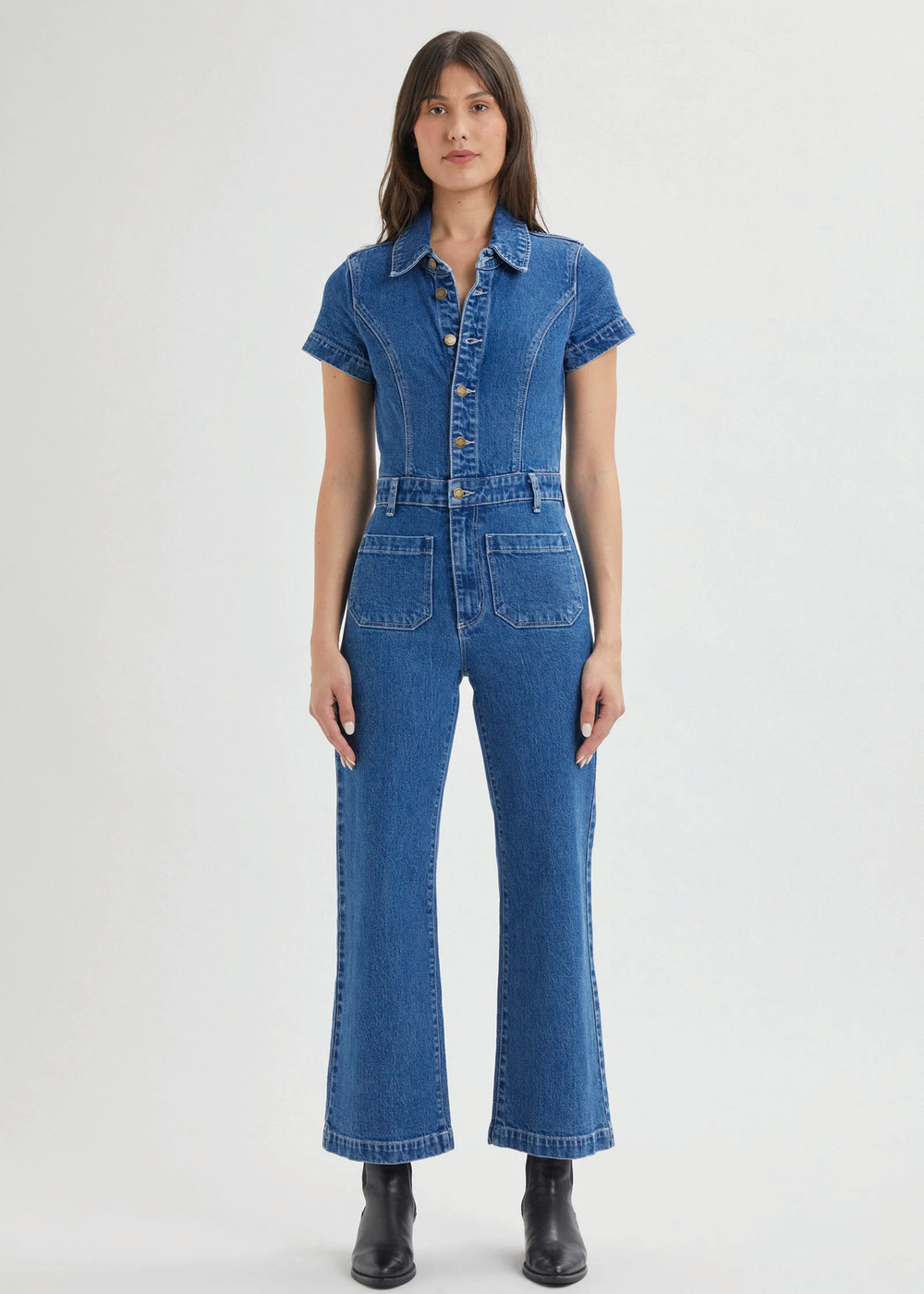 Rolla's Jeans retro 70s inspired blue denim jumpsuit featuring a collared neckline, button front, patch sailor pockets at front, and a wide sailor leg with a cropped ankle length.