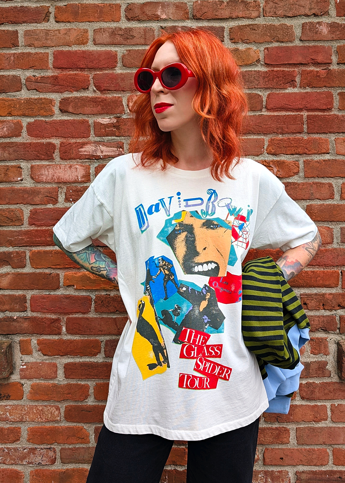 Slouchy, oversized fit white tee with colorful David Bowie The Glass Spider Tour graphics at front. Made in the USA and officially licensed