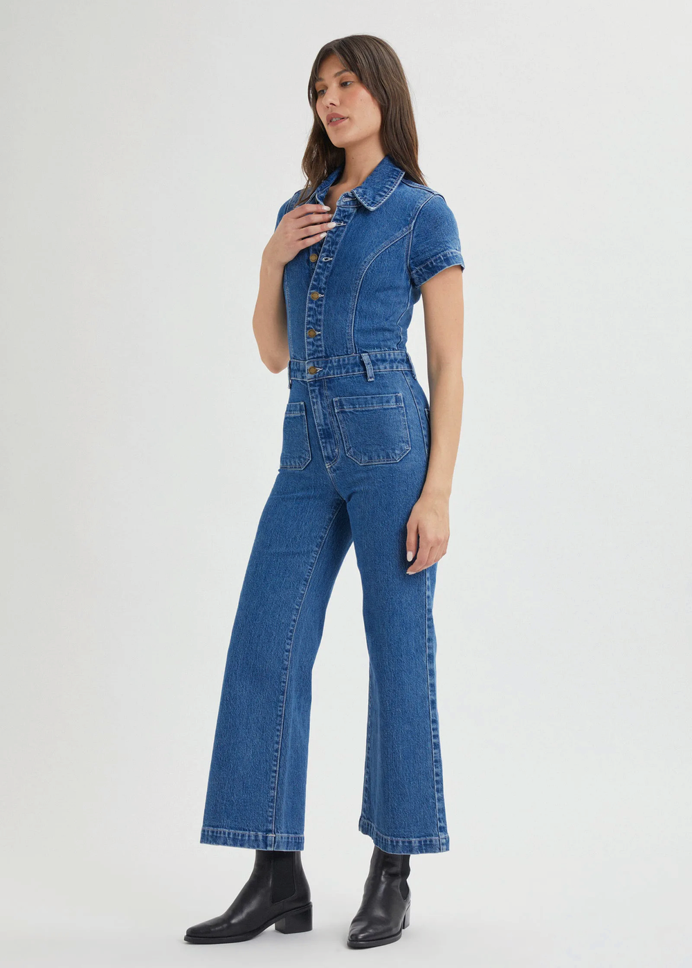 Rolla's Jeans retro 70s inspired blue denim jumpsuit featuring a collared neckline, button front, patch sailor pockets at front, and a wide sailor leg with a cropped ankle length.