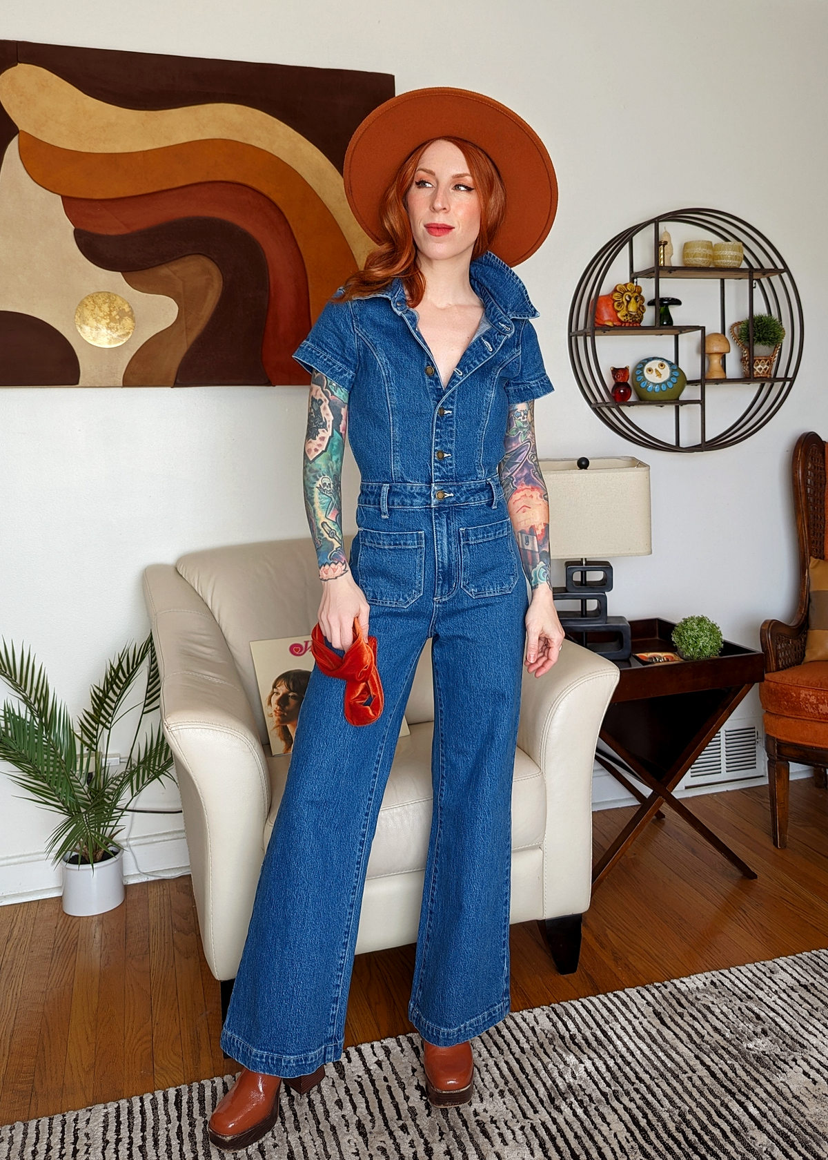 Rolla's Jeans retro 70s inspired blue denim jumpsuit featuring a collared neckline, button front, patch sailor pockets at front, and a wide sailor leg with a cropped ankle length.