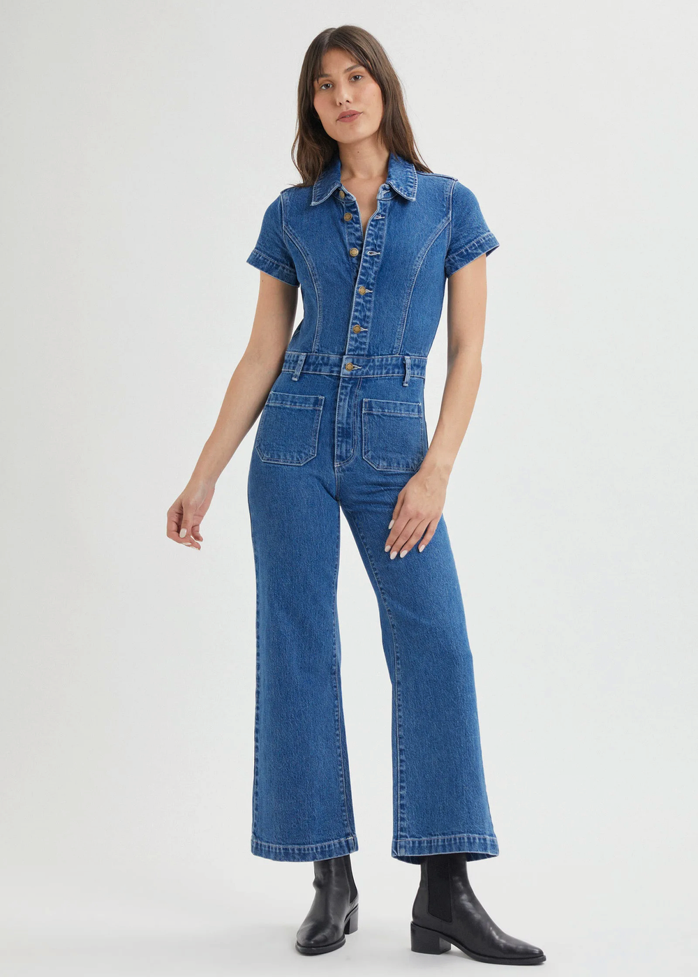 Rolla's Jeans retro 70s inspired blue denim jumpsuit featuring a collared neckline, button front, patch sailor pockets at front, and a wide sailor leg with a cropped ankle length.