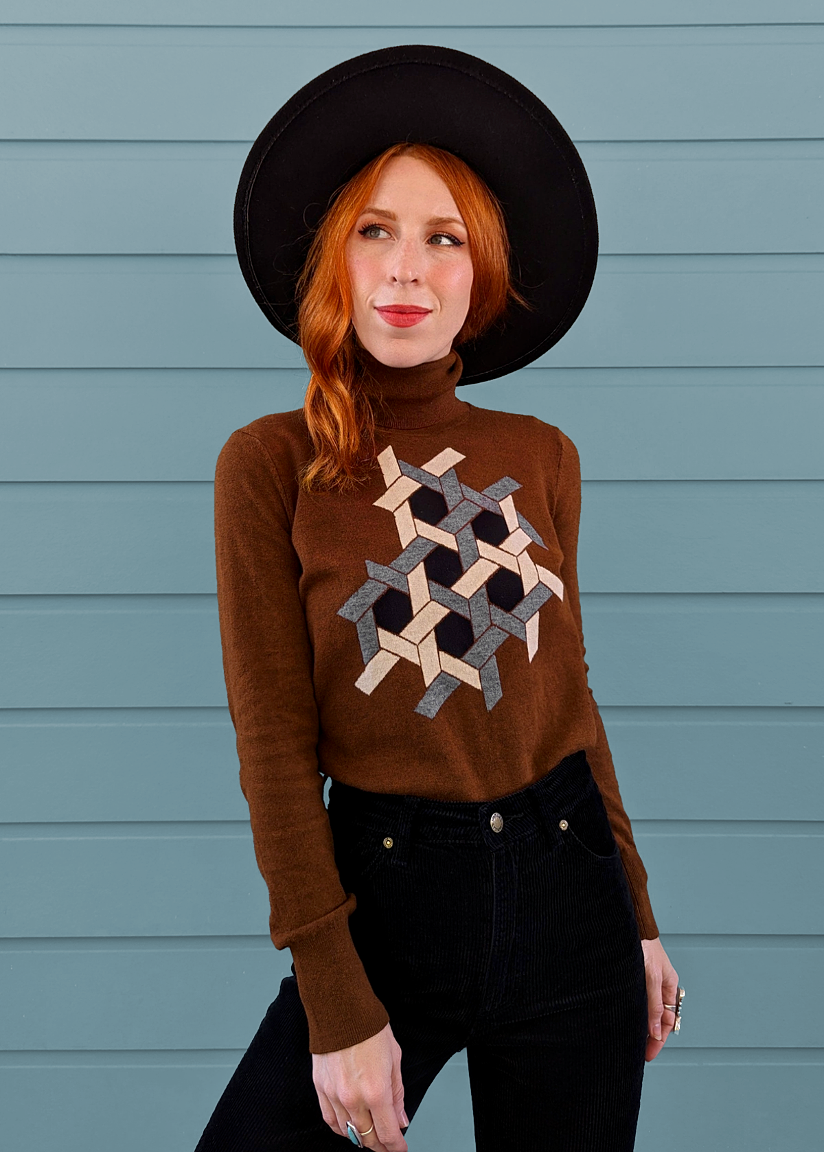 70s inspired brown nylon cotton wool turtleneck knit sweater with grey, beige, and black puzzle design at front by Nice Things by Paloma S.