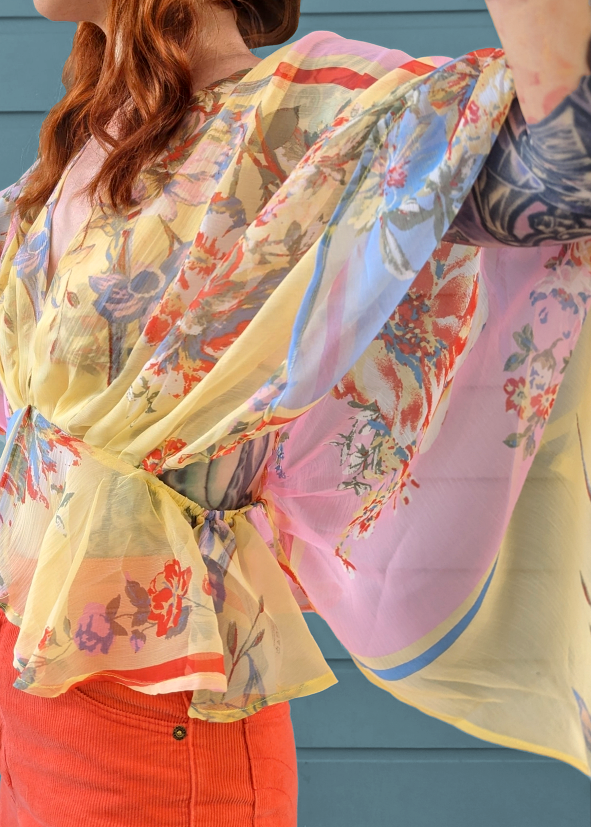 70s inspired dreamy floaty chiffon batwing cape top in yellow, pink, and blue floral by Band of the Free