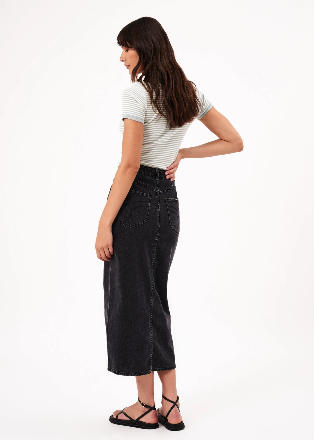 Retro 80s inspired ash black denim Chicago midi skirt with front slit and high rise waist with button fly. By Rolla's Jeans