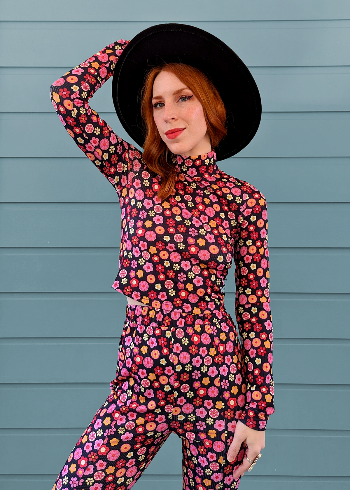 60s floral stretch rib mock neck long sleeve crop top with daisy pattern in black, pink, orange by Glamorous UK
