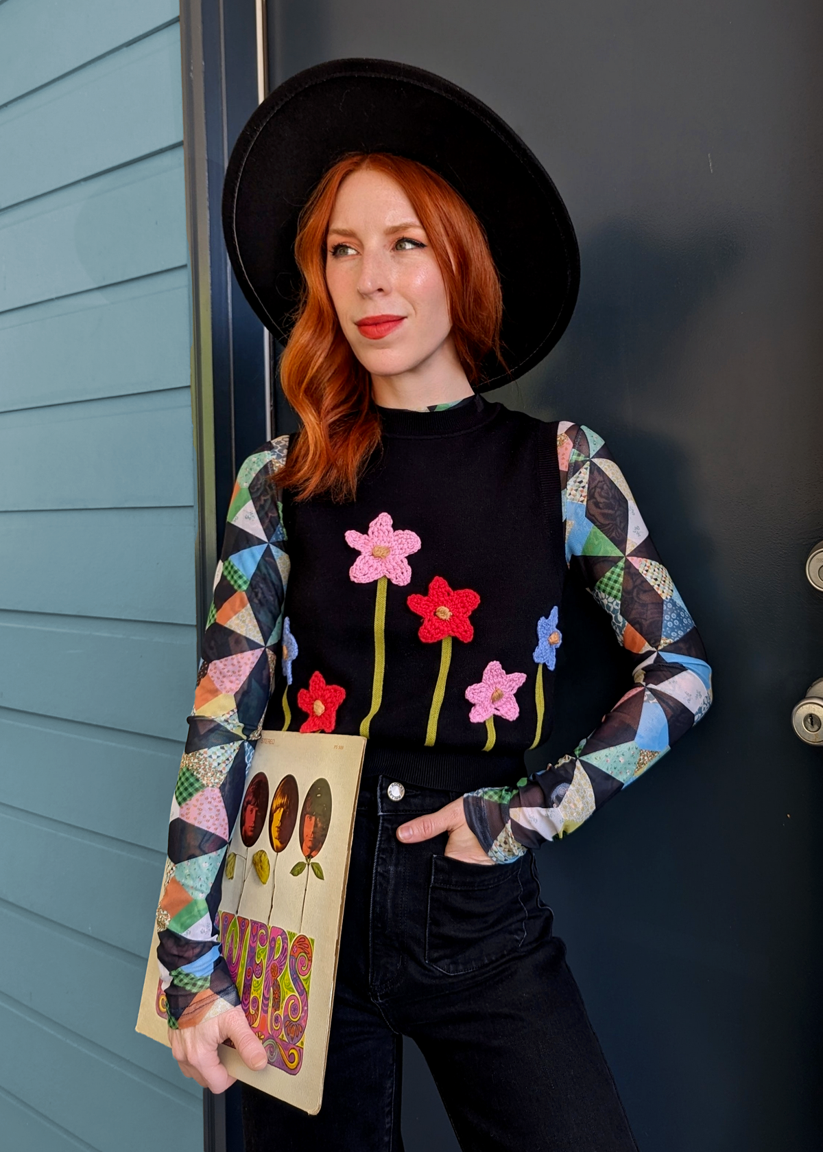 Black Organic Cotton Knit Sweater Vest with colorful crochet flowers at front, by Another Girl, sustainable and ethically made