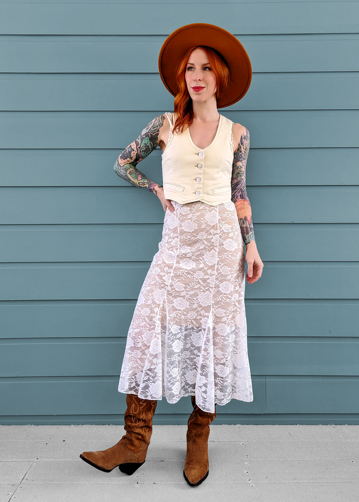 90s inspired sheer unlined white lace floral midi dress with sleeveless design and deep-v neckline - layered over a vest -  by Motel Rocks