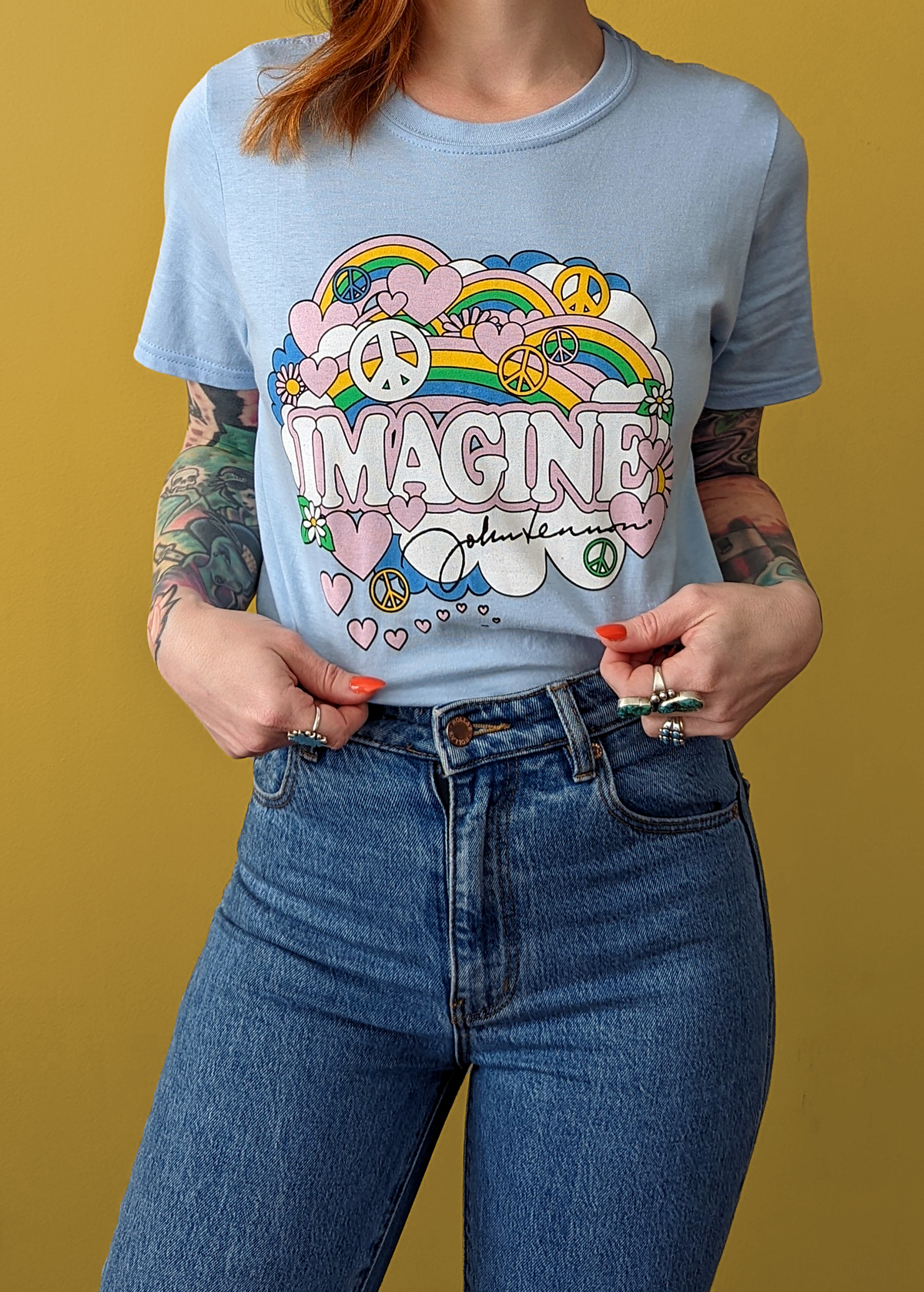 Psychedelic John Lennon Imagine baby blue tee with peace signs, clouds, and rainbows by Daisy Street