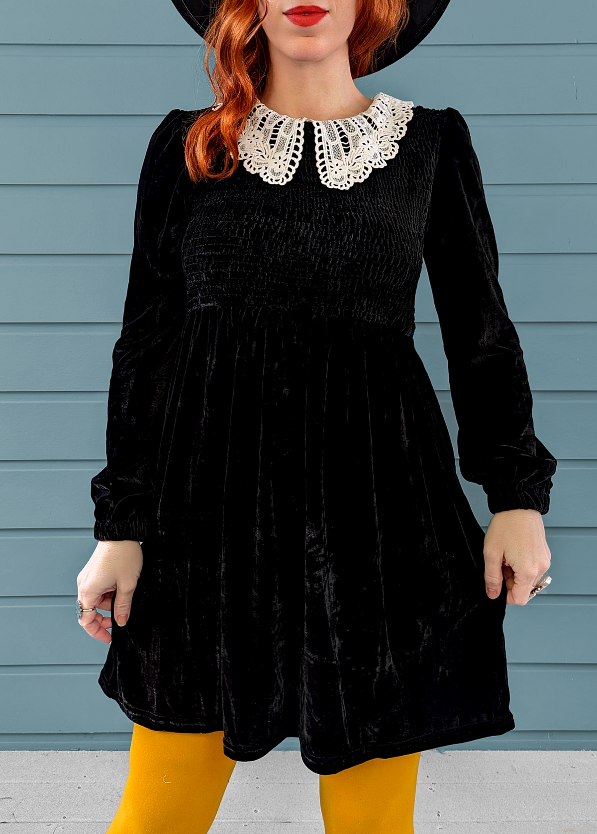 Daisy Street Wednesday Addams Doll Parts Black Velvet Babydoll Dress with smocked detailing and white lace collar. Giving 60s meets 90s vibes!