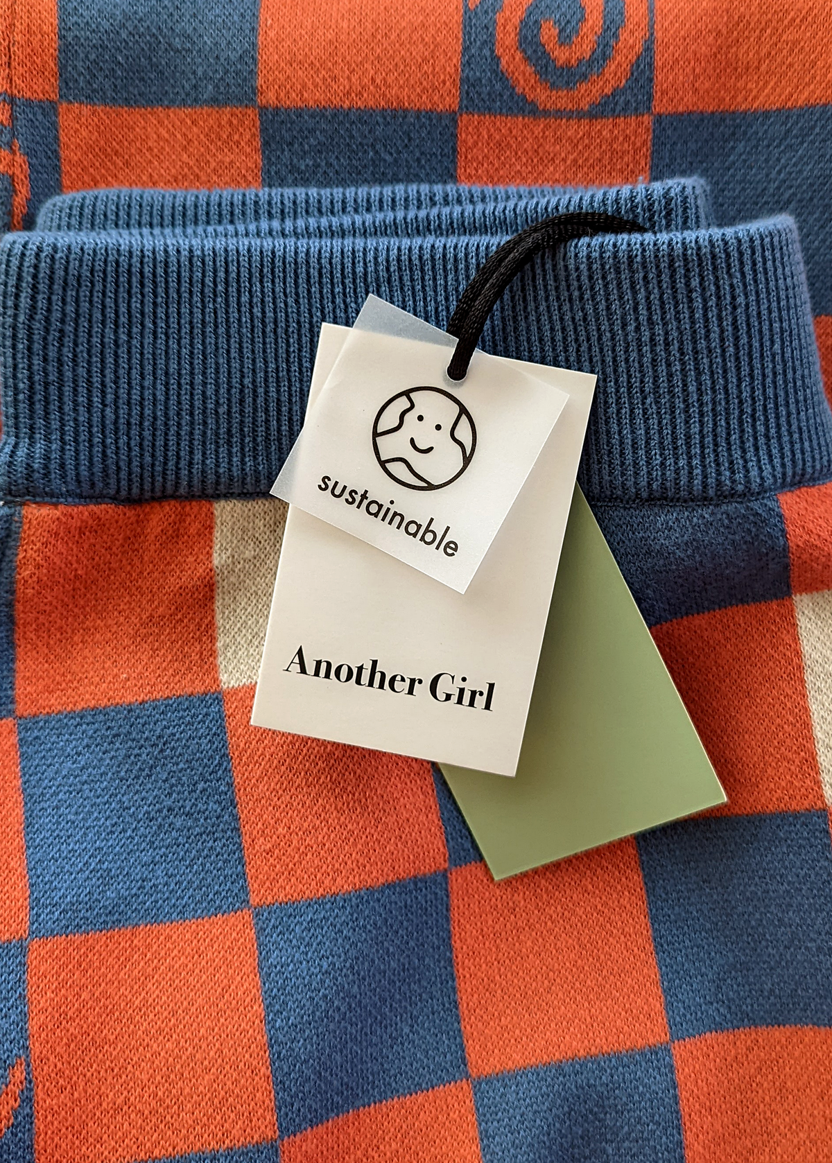 70s inspired orange, blue and white check and swirl organic cotton knit flares by Another Girl, sustainable and ethically made
