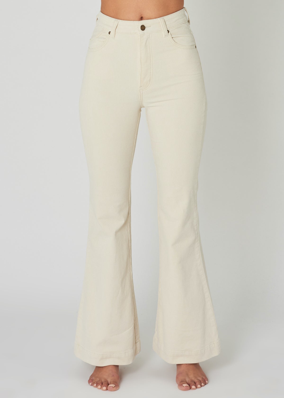 The Vanilla Cream Eastcoast Corduroy Flares by Rolla's Jeans. 70s inspired and features a high Rise waist, bell bottom leg, all in a vanilla cream corduroy
